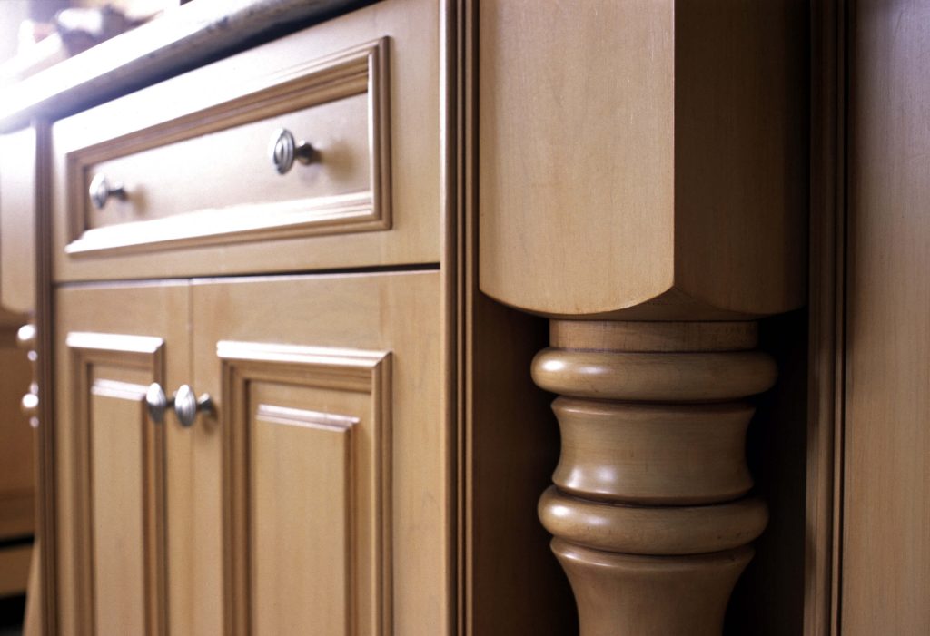 Turned maple post beside raised-panel doors