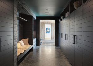 Custom mudroom cabinetry with built-in storage and tiled flooring at St. Croix Residence